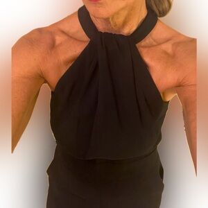 Halter style pants suit, hip pockets, back zip,boot style cut pant bottoms size8